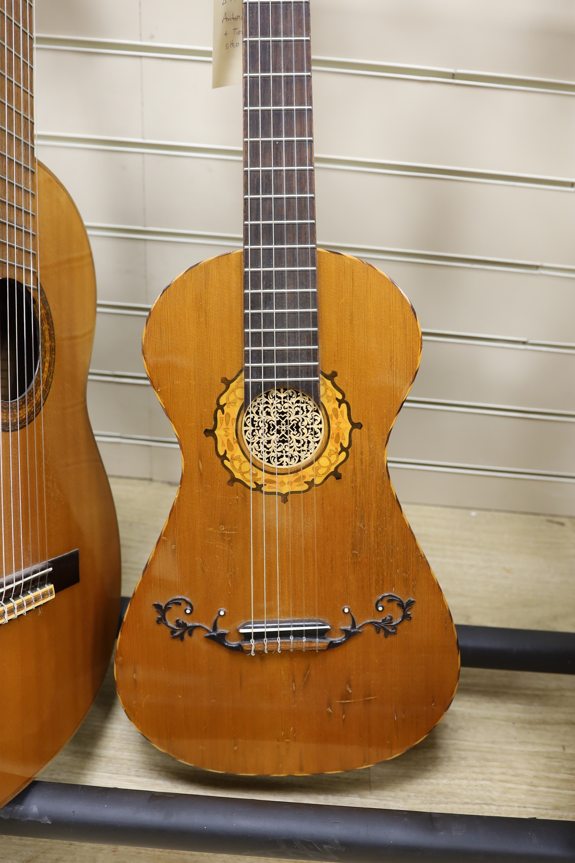 An acoustic guitar, labelled internally Antoria G 974 and two others